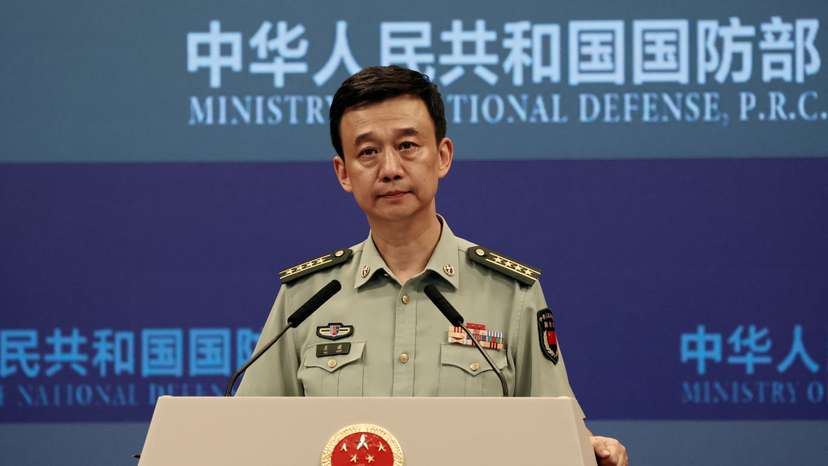 Chinese Defence Ministry spokesperson Wu Qian attends a press briefing in Beijing