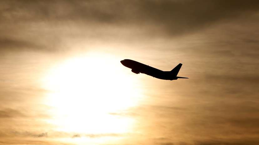 A plane is seen during sunrise at the international airport in Munich