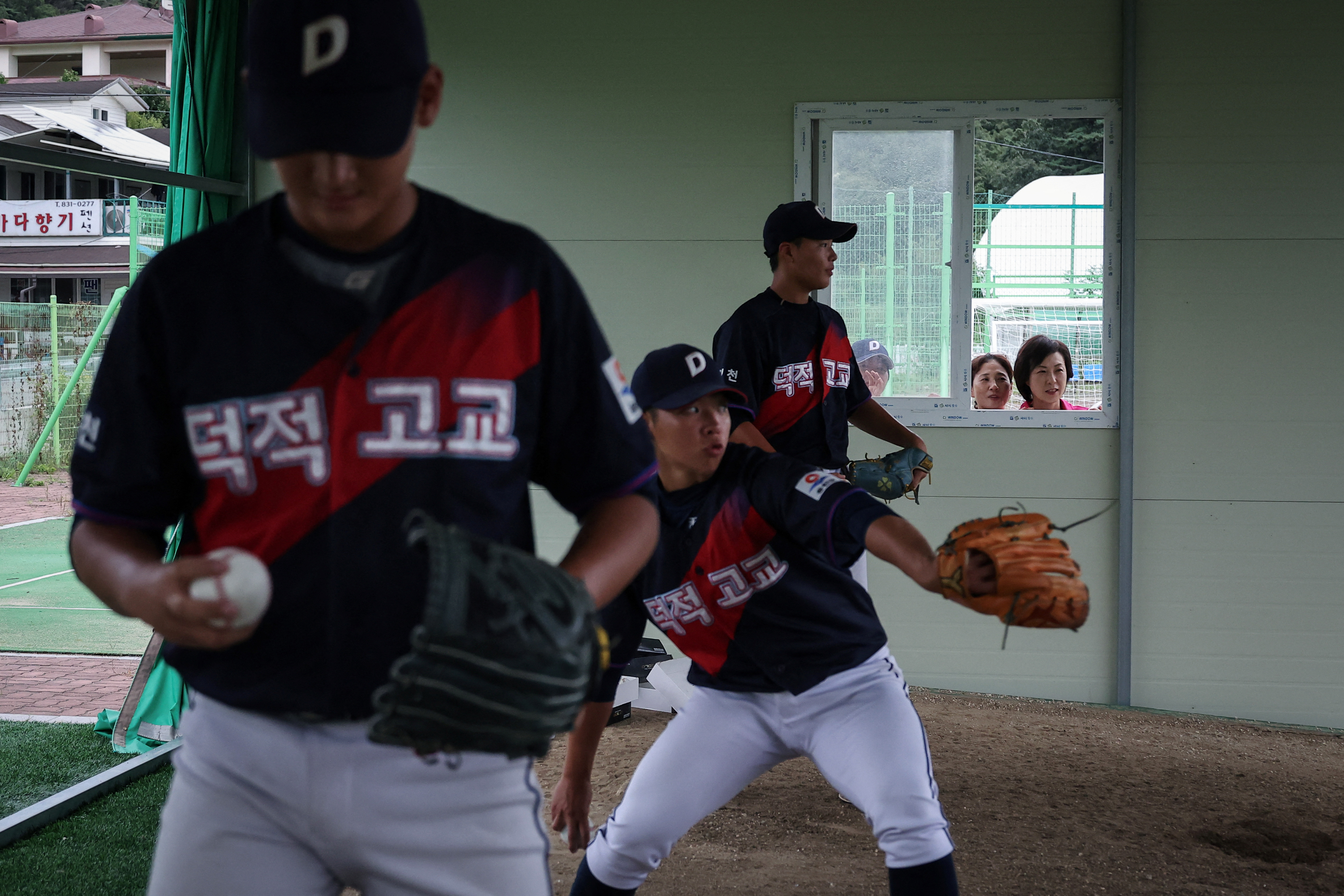 The Wider Image: South Korea island is a field of dreams for young baseball hopefuls