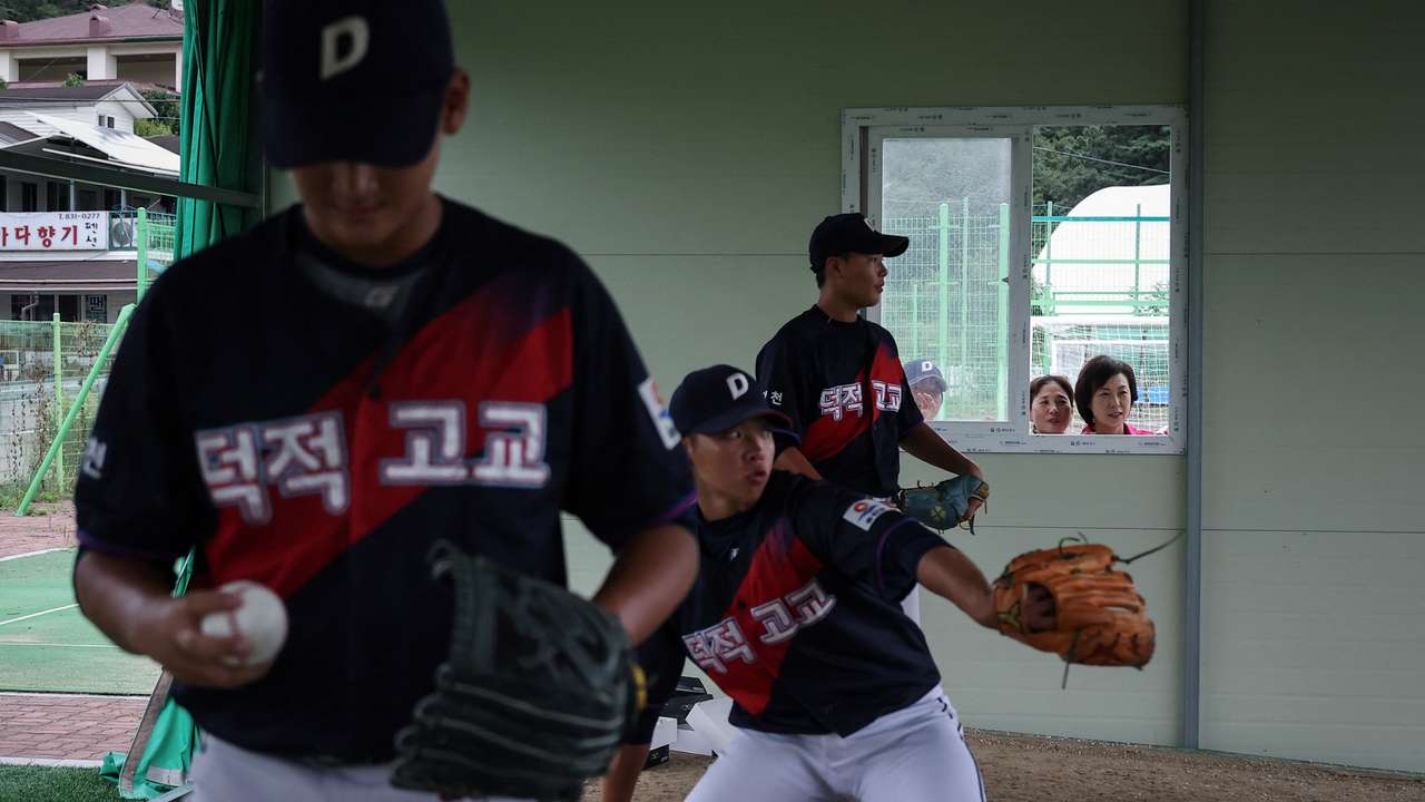 The Wider Image: South Korea island is a field of dreams for young baseball hopefuls