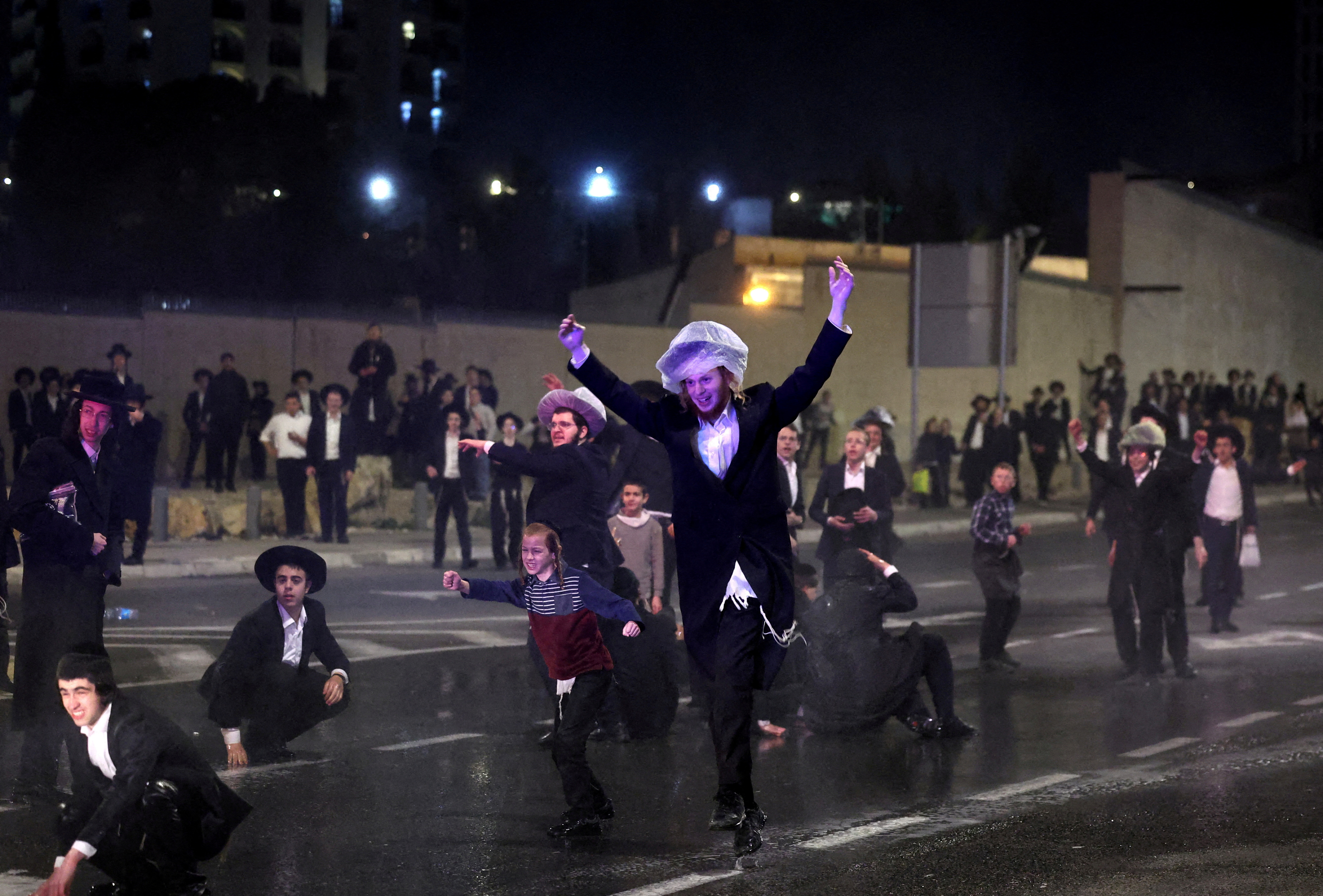 FILE PHOTO: Ultra-Orthodox Jewish men protest against attempts to change government policy that grants ultra-Orthodox Jews exemptions from military conscription, in Jerusalem