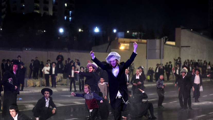 FILE PHOTO: Ultra-Orthodox Jewish men protest against attempts to change government policy that grants ultra-Orthodox Jews exemptions from military conscription, in Jerusalem