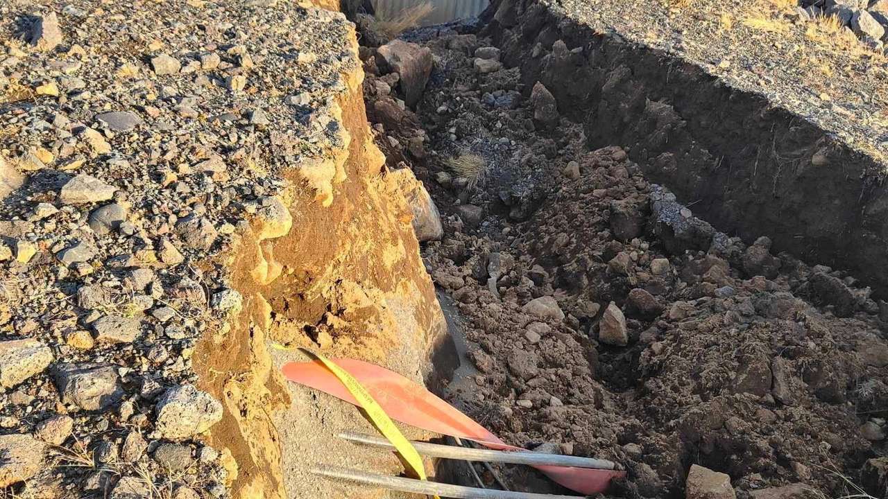 A view of cracks, emerged on a road due to volcanic activity, near Grindavik