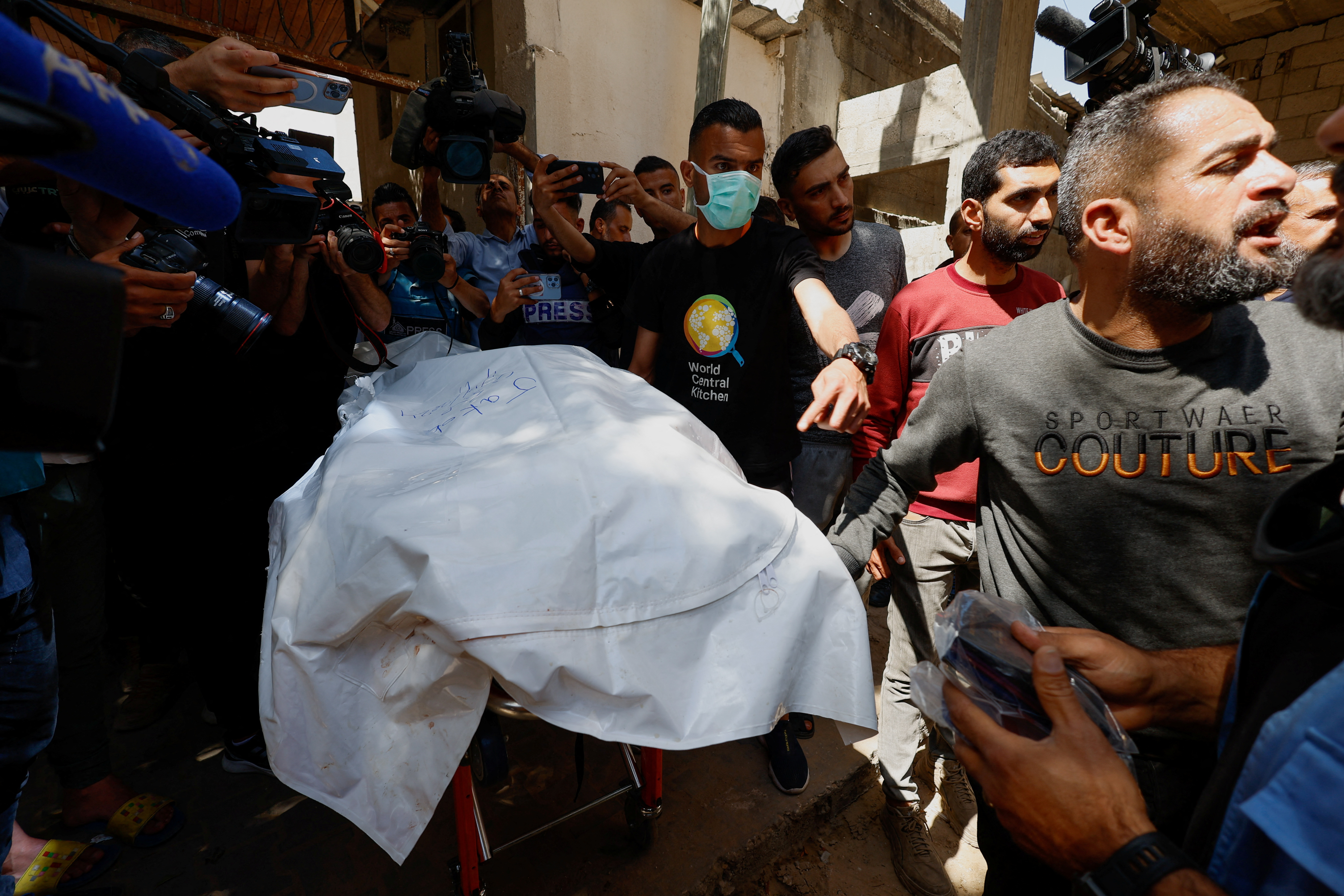Bodies of foreign WCK workers killed in an Israeli strike are transported to their families outside Gaza, in Rafah, southern Gaza Strip