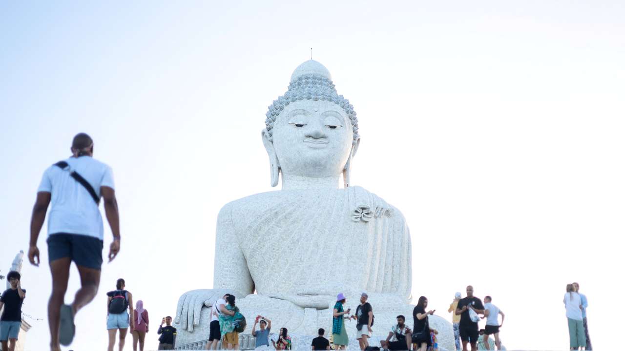 Tourists visit the Big Buddha statue in Phuket