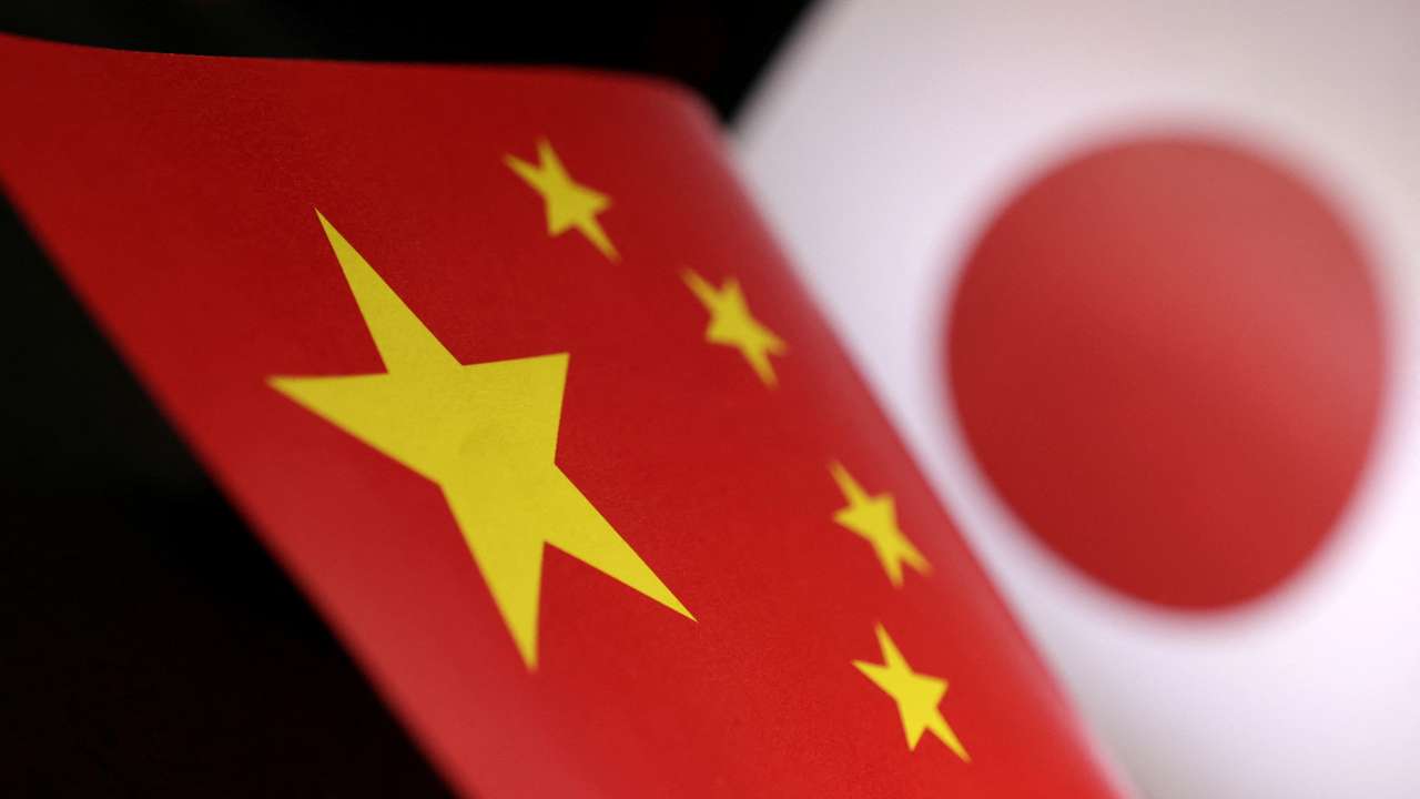 Illustration shows printed Chinese and Japanese flags