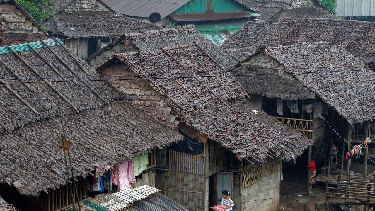 FILE PHOTO: Refugees who fled Myanmar are seen at their stilt houses at Mae La refugee camp, near the Thailand-Myanmar border in Mae Sot district