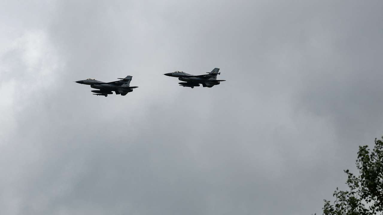 Ukrainian F-16 fighting aircrafts are seen in the air during marking the Day of the Ukrainian Air Forces in an undisclosed location in Ukraine