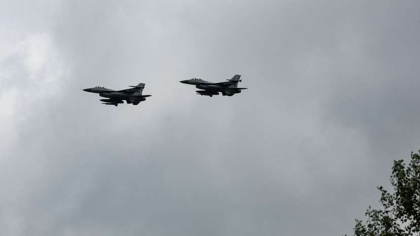 Ukrainian F-16 fighting aircrafts are seen in the air during marking the Day of the Ukrainian Air Forces in an undisclosed location in Ukraine