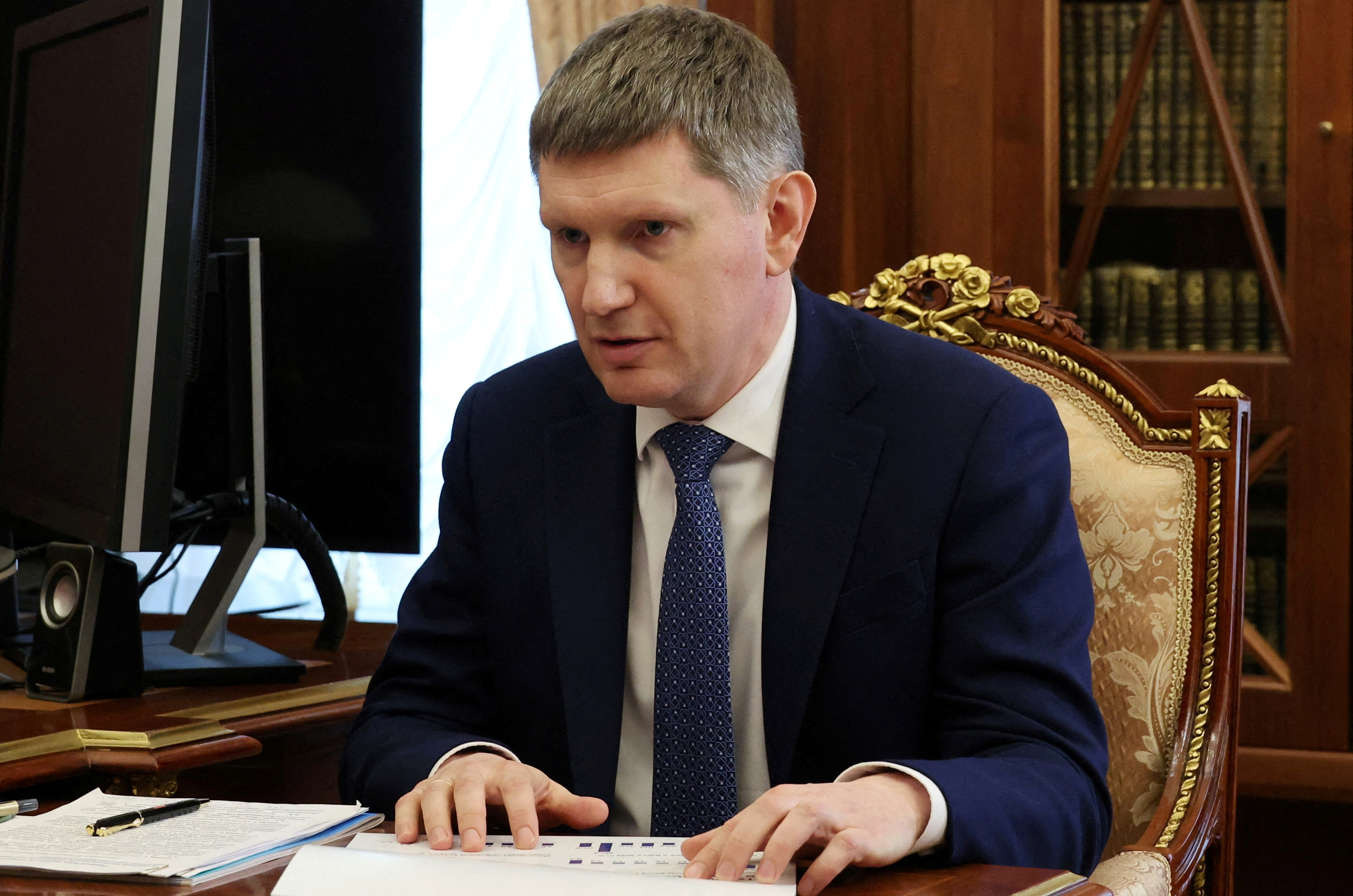 FILE PHOTO: Russian President Vladimir Putin meets with Economic Development Minister Maxim Reshetnikov in Moscow