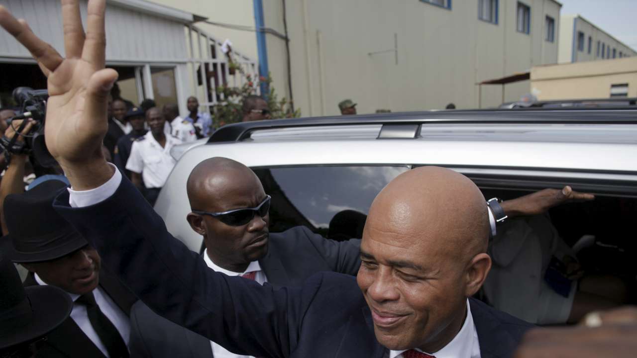 Martelly says goodbye after a ceremony marking the end of his presidential term, at the Haitian Parliament in Port-au-Prince, Haiti