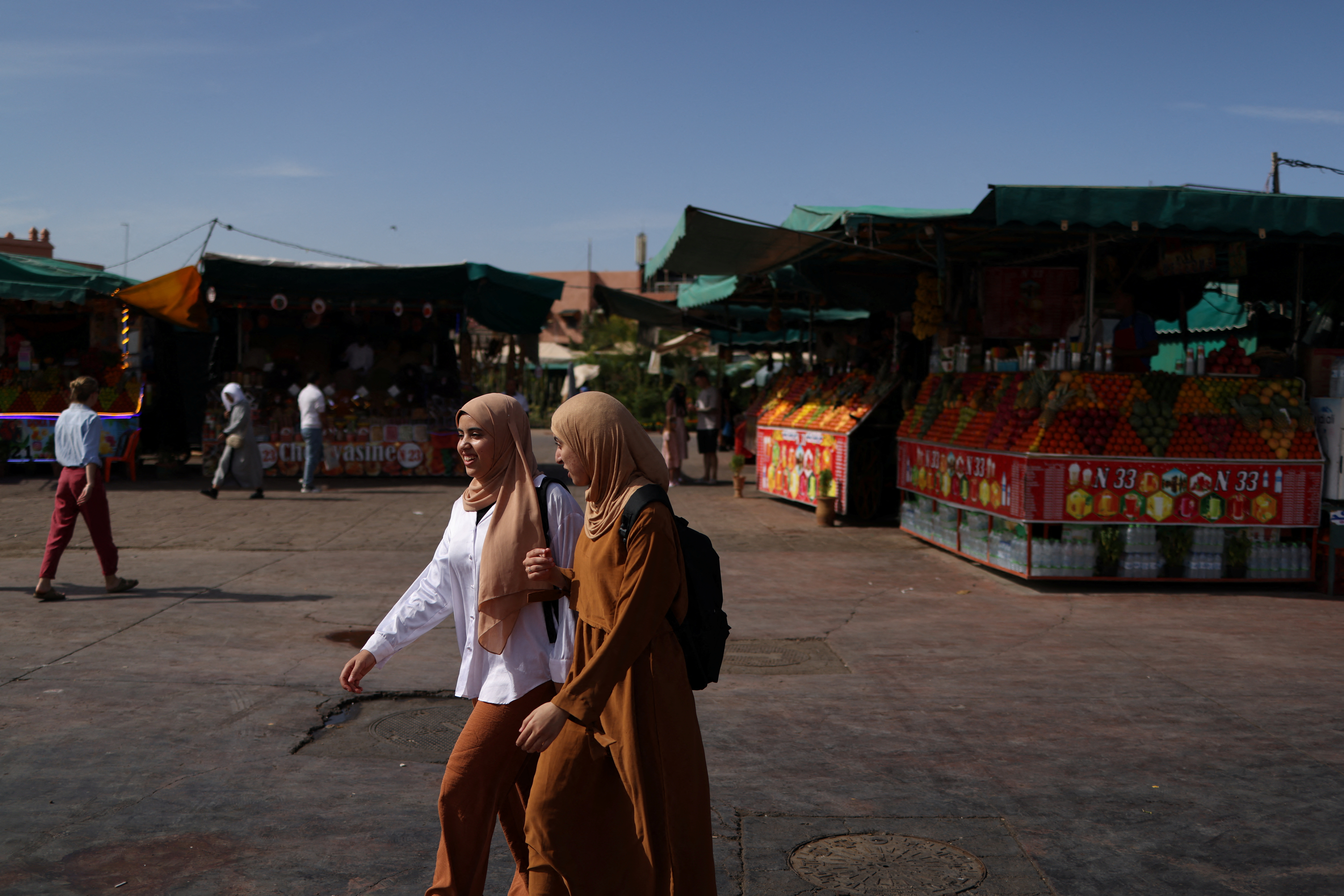 People walk in Jemaa el-Fnaa square, in Marrakesh