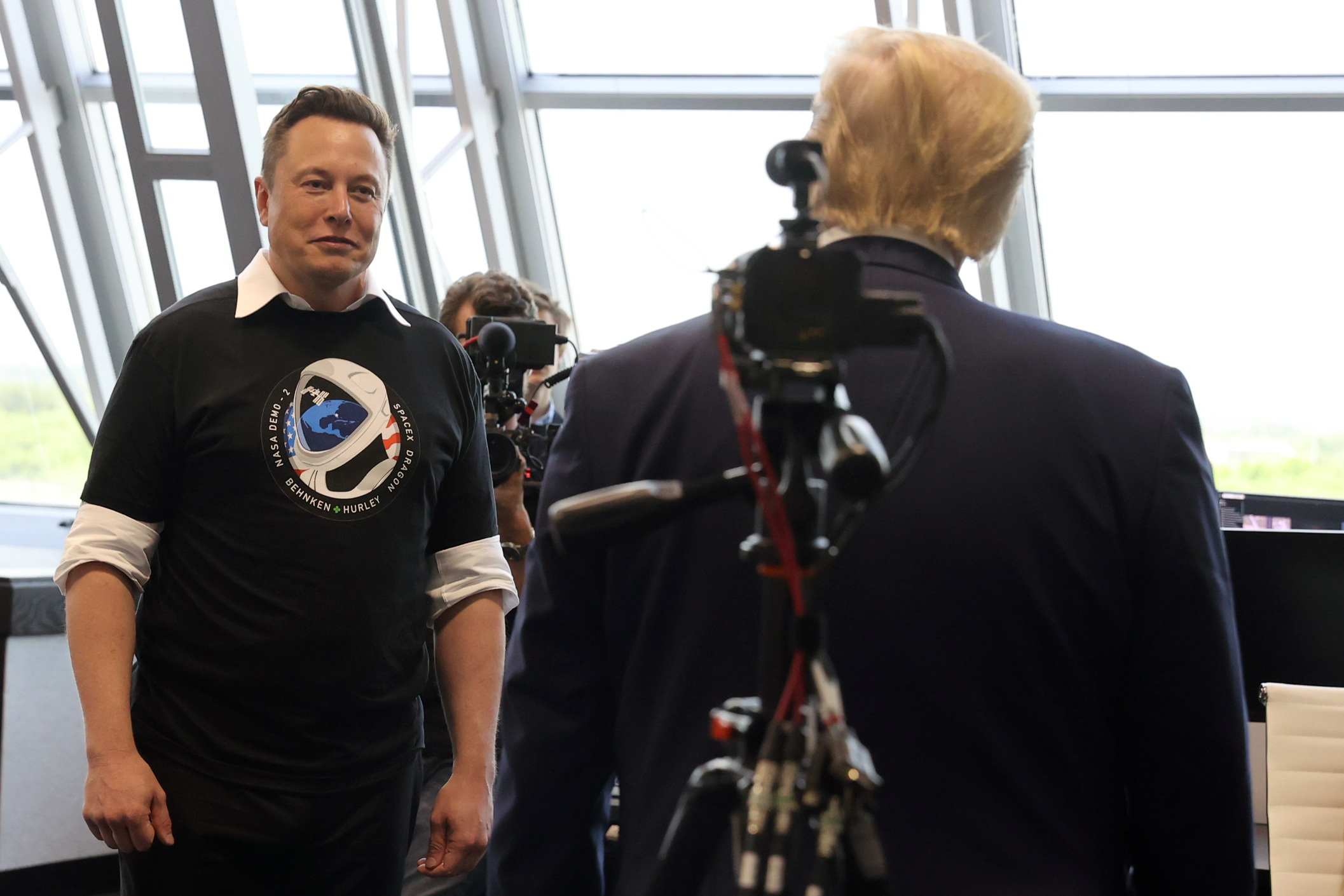 pU.S. President Donald Trump and Elon Musk are seen at the Firing Room Four after the launch of a SpaceX Falcon 9 rocket and Crew Dragon spacecraft, from Cape Canaveral
