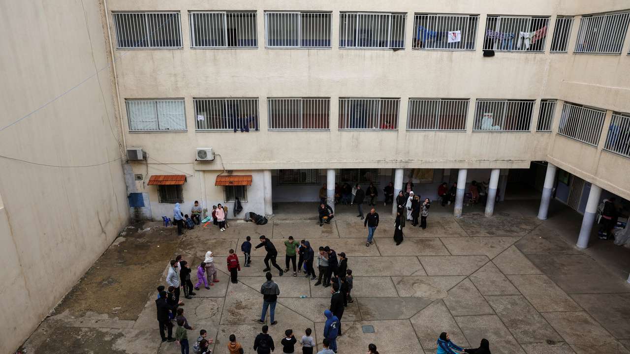 Children play at the yard of a school used as a temporary shelter for displaced people, following an escalation between Hezbollah and Israel, amid the U.S.-Israeli conflict with Iran, in Beirut