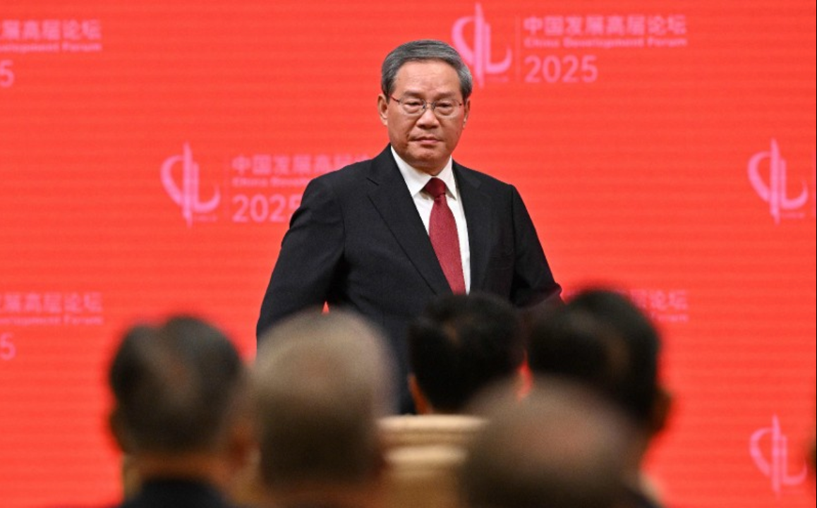 China's Premier Li Qiang walks after concluding his speech during the opening ceremony of the China Development Forum at the Diaoyutai State Guesthouse in Beijing on March 23, 2025.