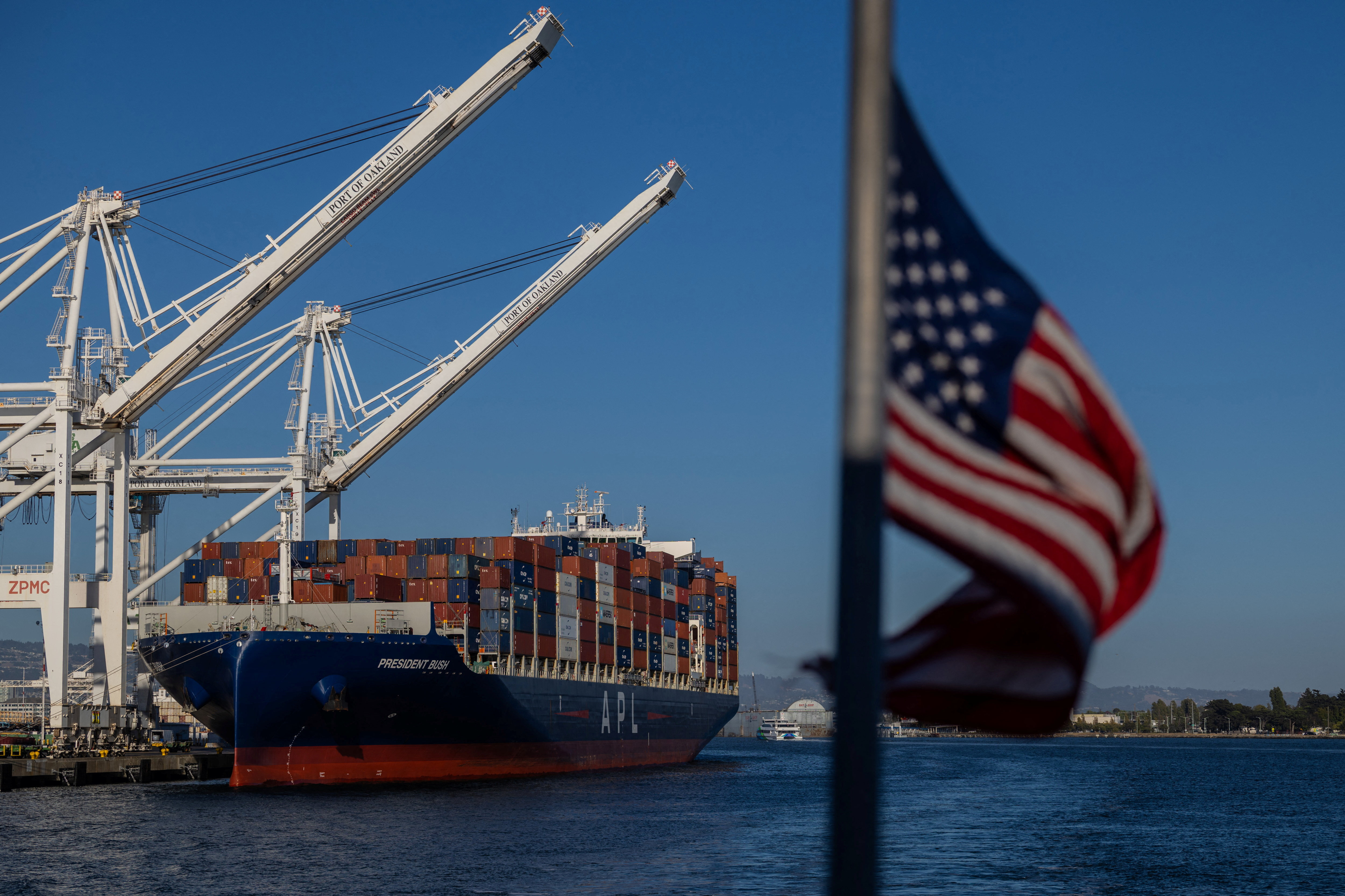 A cargo ship full of shipping containers is seen at the port of Oakland, California