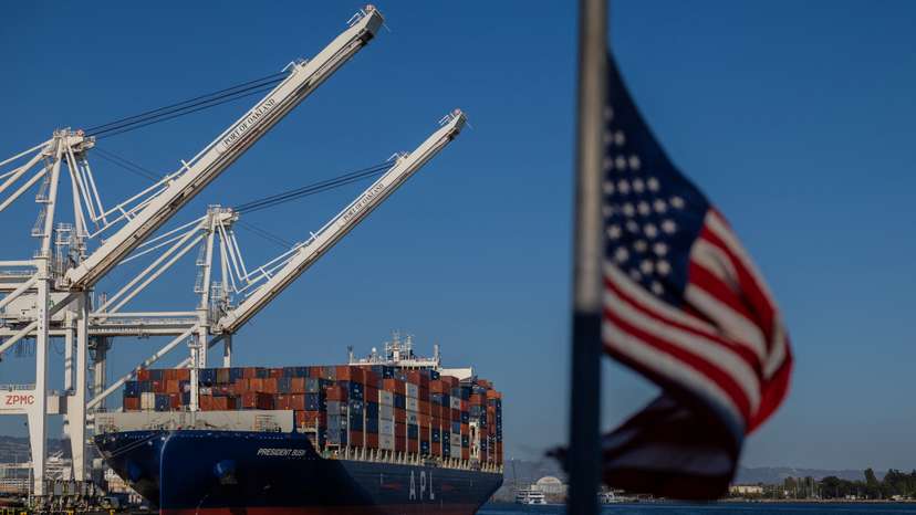 A cargo ship full of shipping containers is seen at the port of Oakland, California