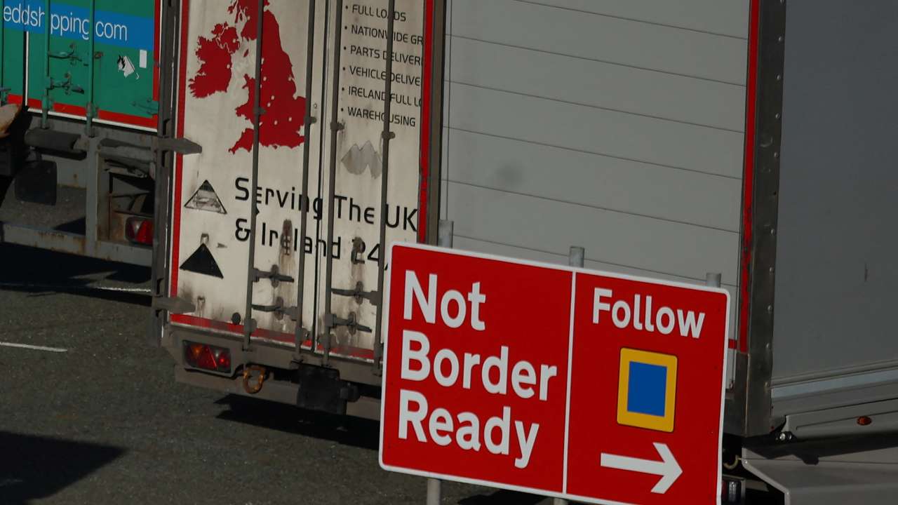 Heavy goods trailers are seen near a 'Not Border Ready' sign in a lorry park at the Port of Holyhead in Holyhead
