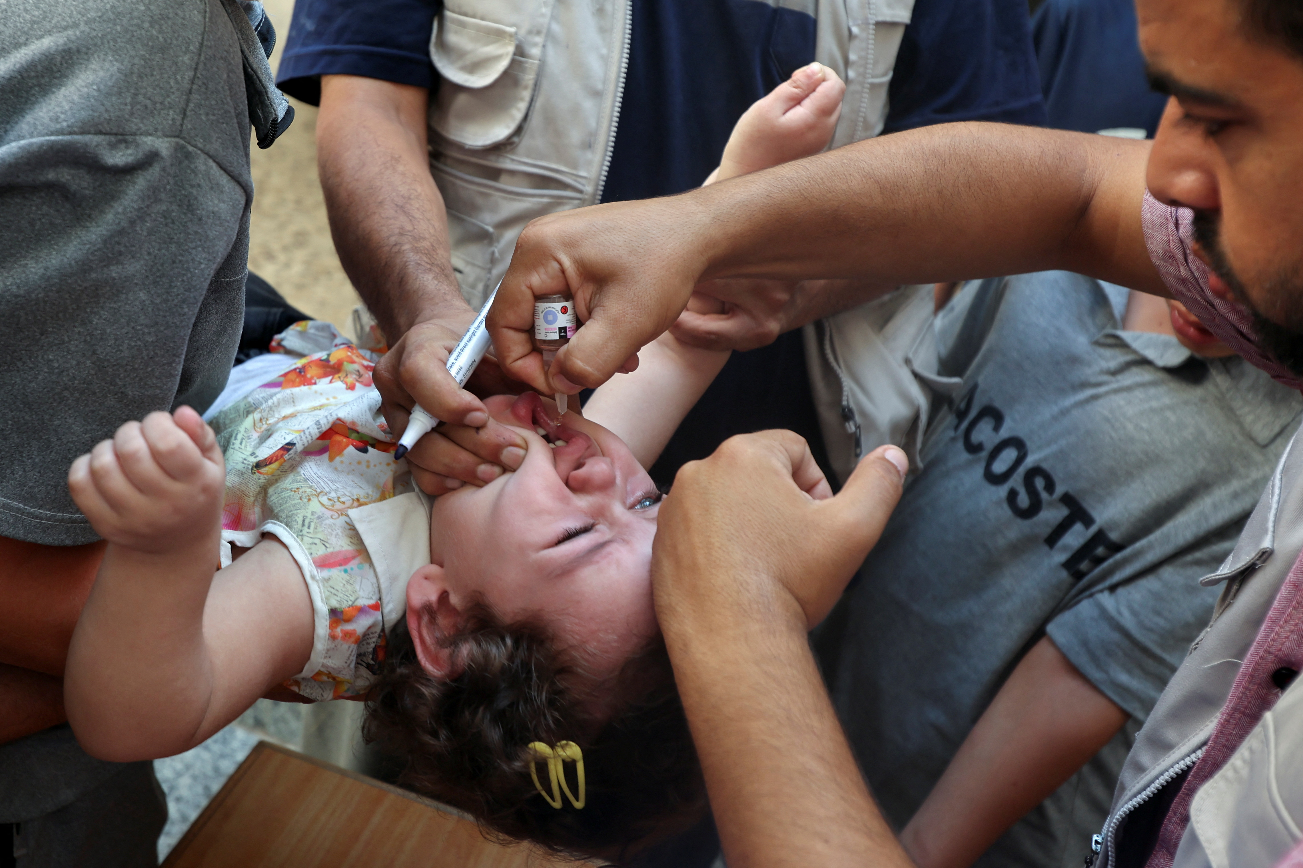 Palestinian children are vaccinated against polio, in Deir Al-Balah in the central Gaza Strip