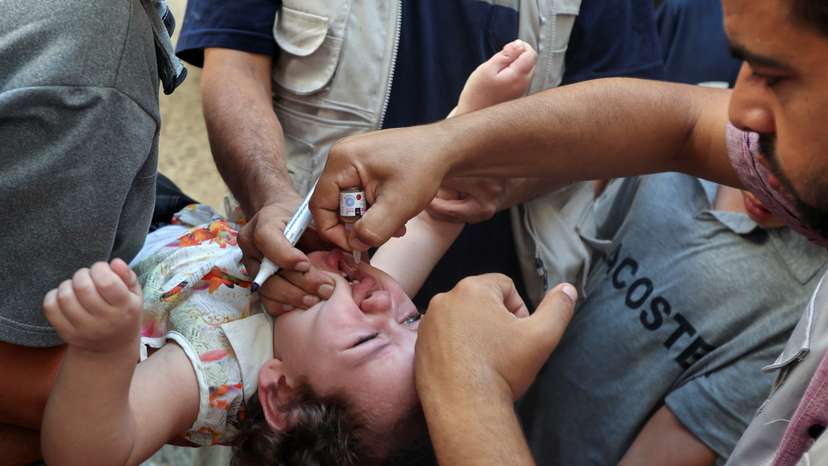 Palestinian children are vaccinated against polio, in Deir Al-Balah in the central Gaza Strip