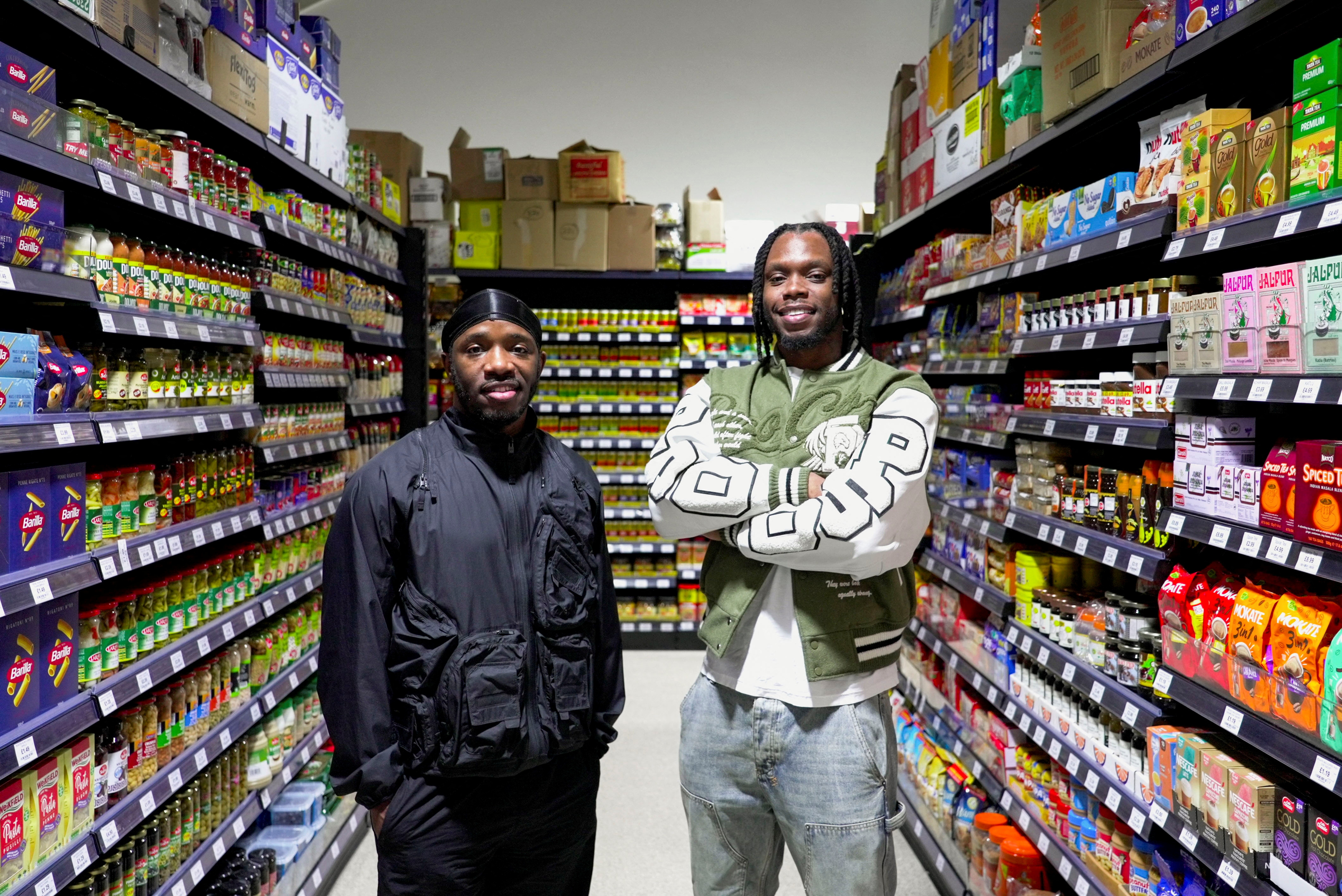 British rappers Krept and Konan stand in their new supermarket called Saveways that caters to ethnic minorities in Croydon