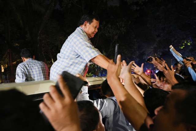 Indonesia's presidential candidate Prabowo Subianto greets his supporters in Jakarta