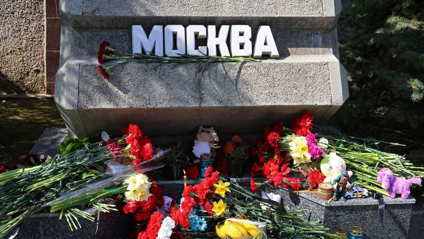 Flowers and toys are placed at the Alley of Hero Cities in memory of the victims of a shooting attack at a concert venue outside Moscow, in Sevastopol