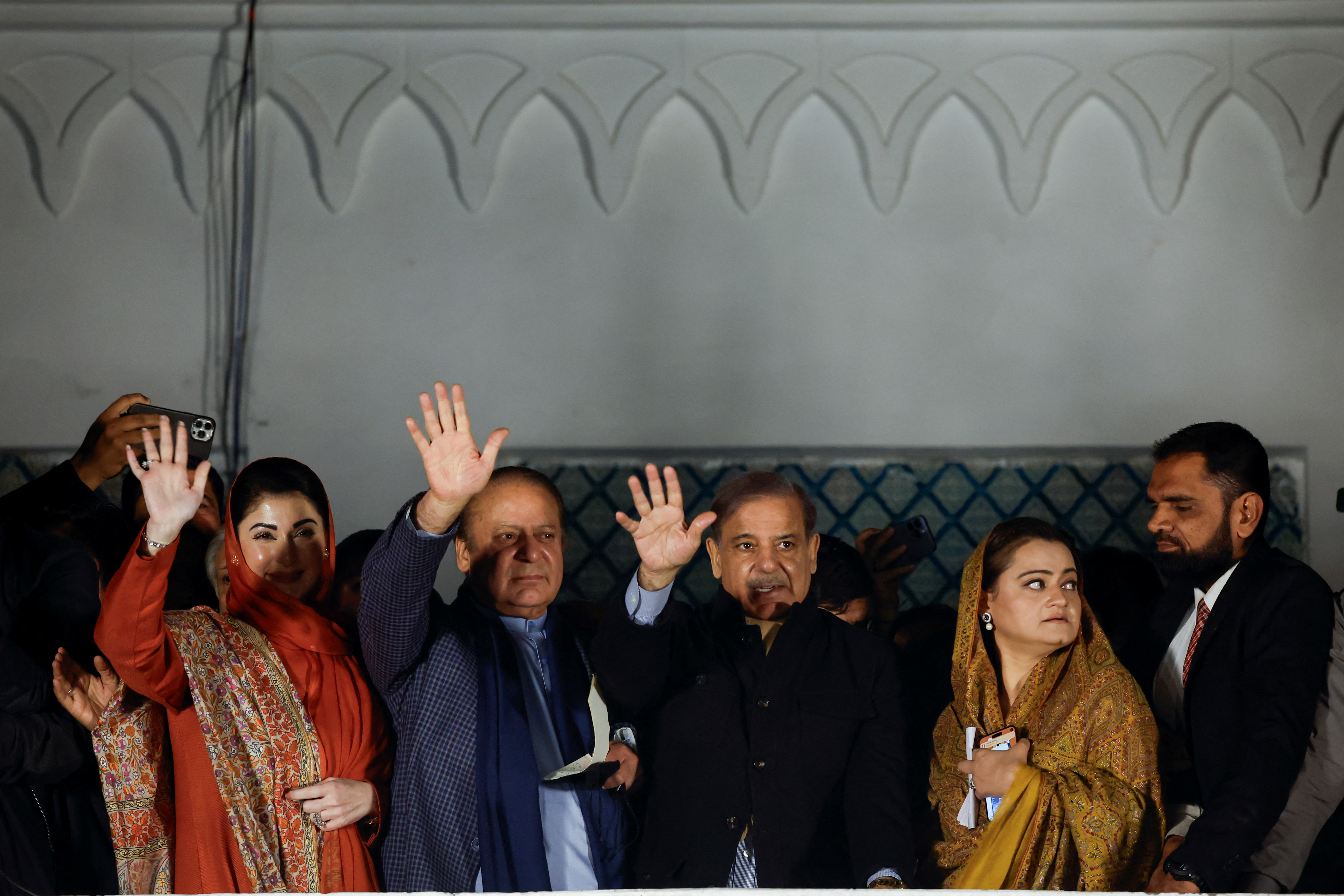 Supporters of Former Prime Minister of Pakistan Nawaz Sharif cheer as they gather at the party office of Pakistan Muslim League (N) at Model Town in Lahore