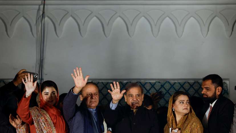 Supporters of Former Prime Minister of Pakistan Nawaz Sharif cheer as they gather at the party office of Pakistan Muslim League (N) at Model Town in Lahore