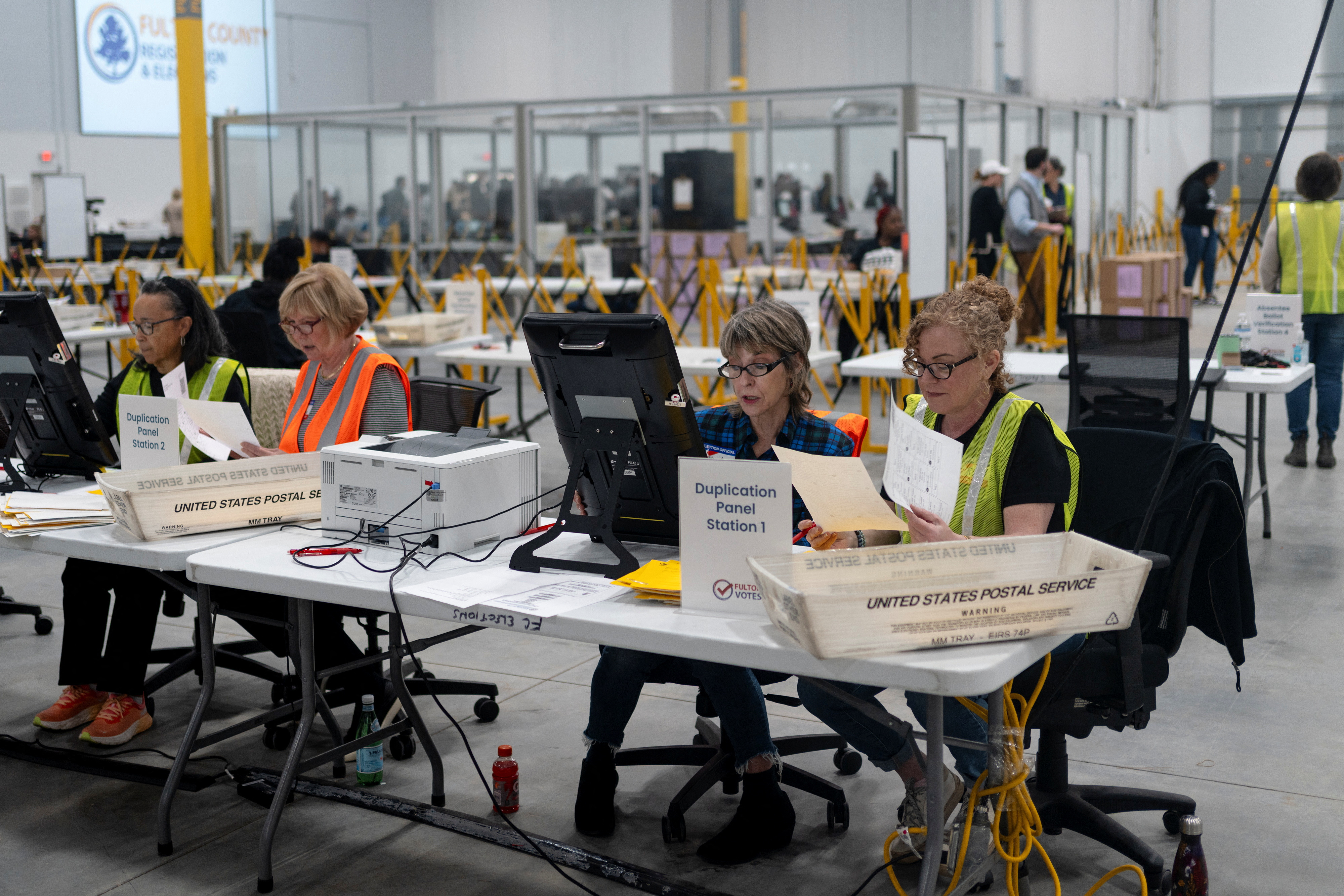 Fulton county workers process absentee ballots at ahead of the U.S, presidential election, in Atlanta