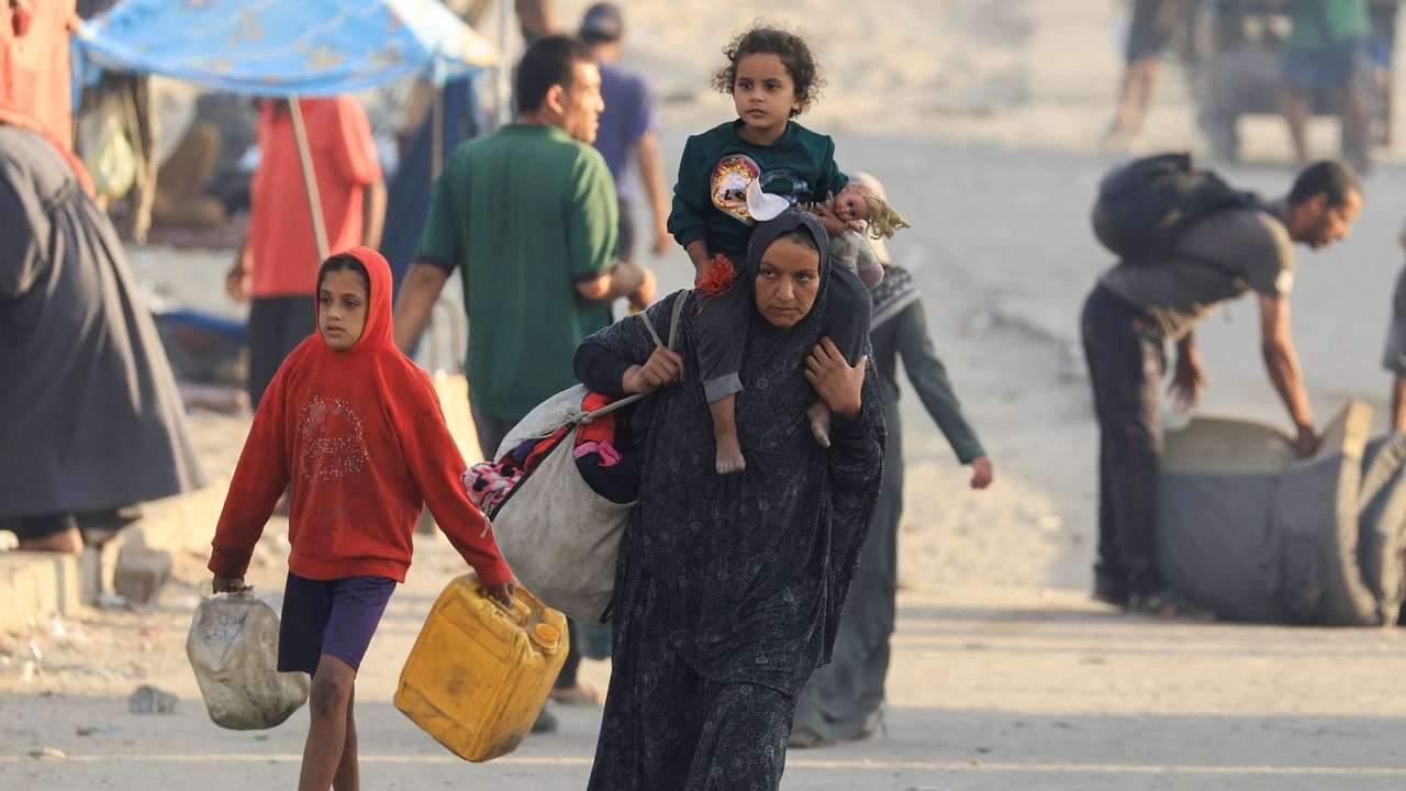 Displaced Palestinians, fleeing northern Gaza due to an Israeli military operation, move southward, in the central Gaza Strip
