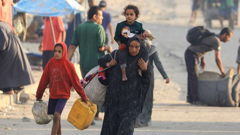 Displaced Palestinians, fleeing northern Gaza due to an Israeli military operation, move southward, in the central Gaza Strip