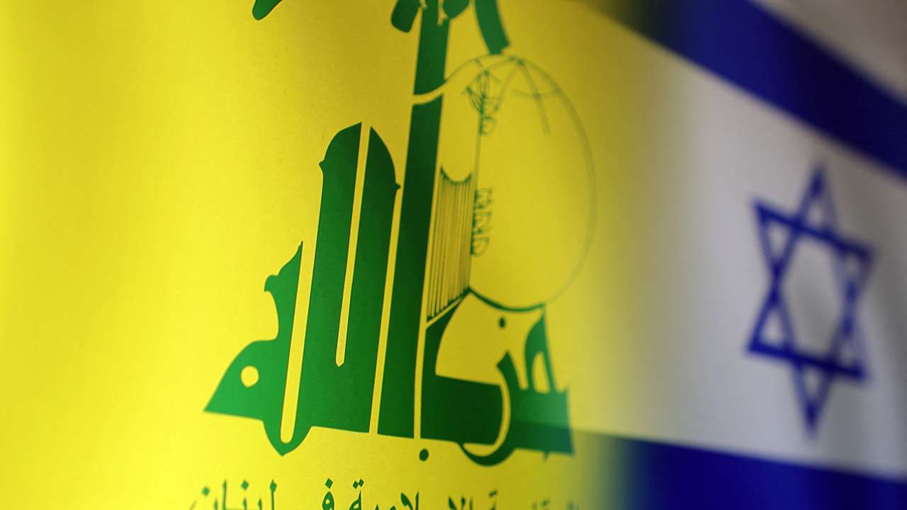 Illustration shows Hezbollah and Israel flags