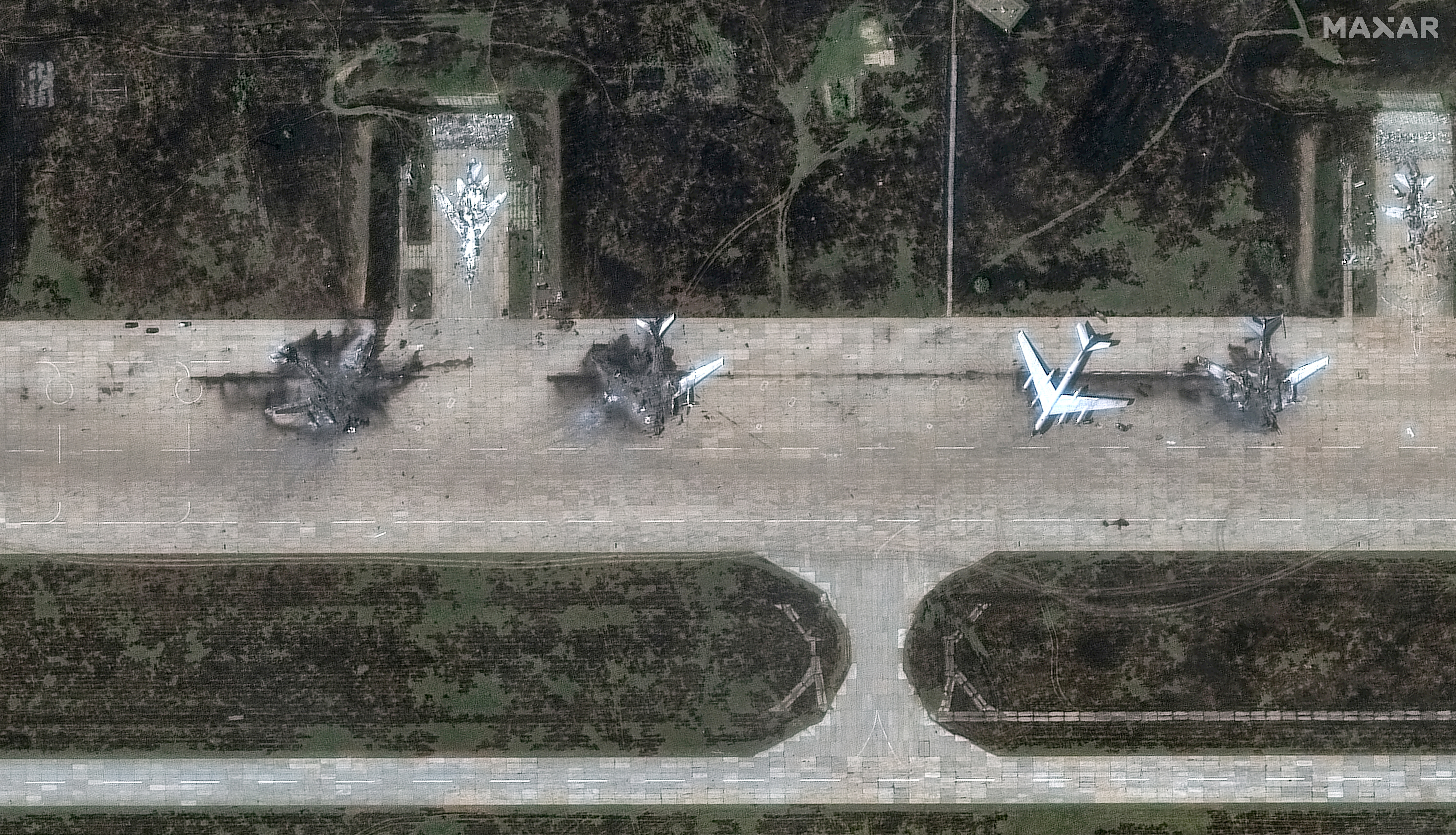 FILE PHOTO: A satellite image shows destroyed TU 95 aircrafts in the aftermath of a drone strike at the Belaya air base