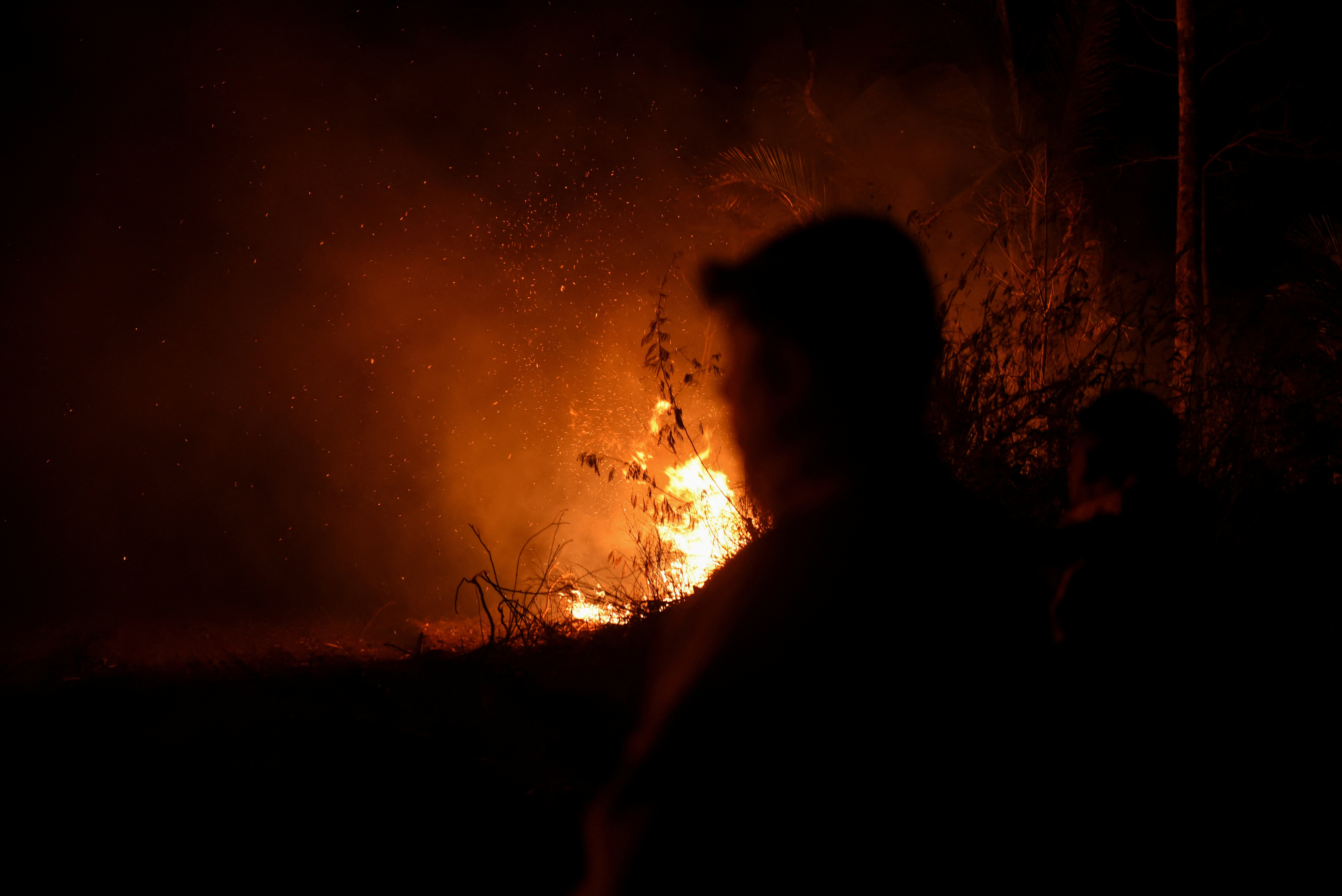 FILE PHOTO: Wildfire smoke covers the sky as Bolivia's forests burn, in Nuflo de Chavez Province