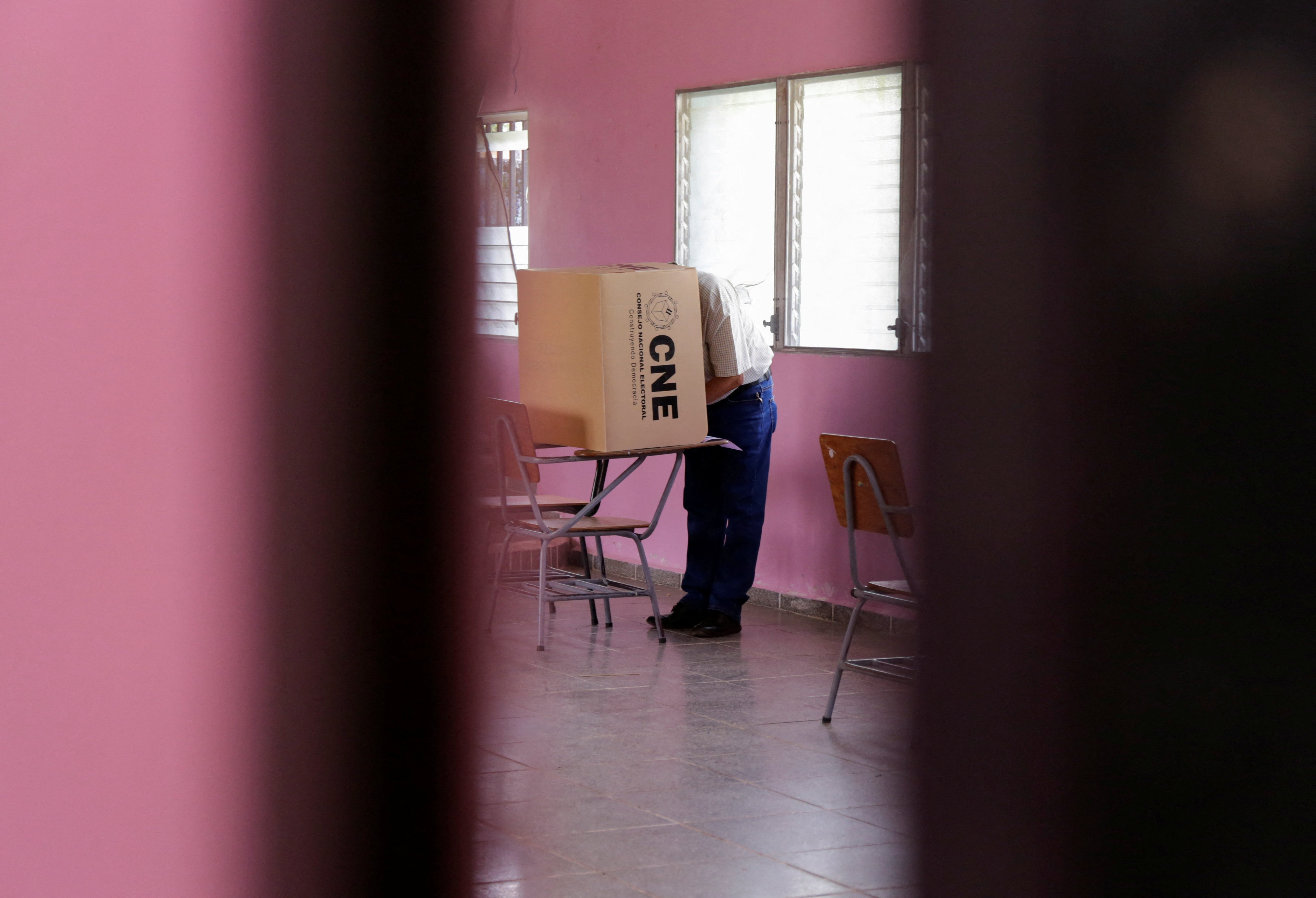 Residents head to vote in a rural town a week after election day, in San Antonio de Flores