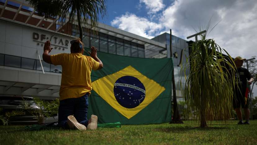Supporters of former President Jair Bolsonaro gather in front of the DF Star Hospital where he underwent surgery in Brasilia