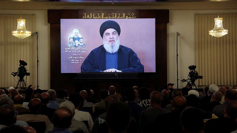 Lebanon's Hezbollah leader Sayyed Hassan Nasrallah speaks during a televised address at a memorial service in Beirut's southern suburbs