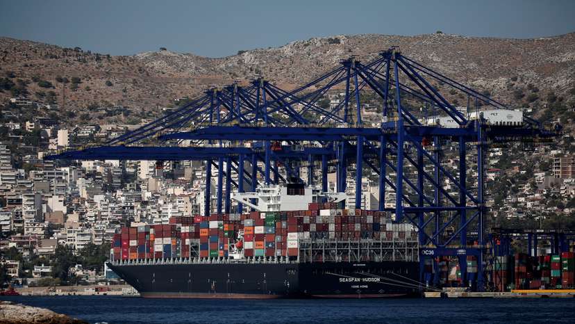 A cargo ship is moored at the Piraeus Container Terminal, near Athens