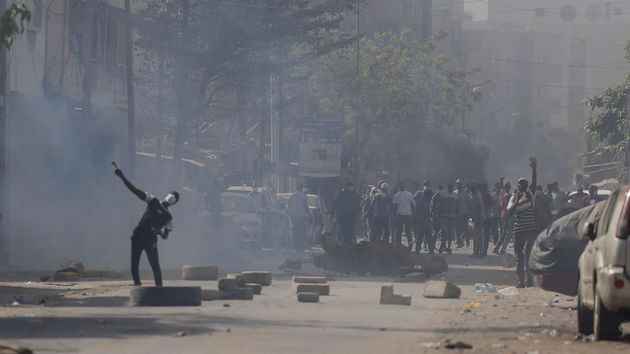Senegalese demonstrators protest against the postponement of the Feb. 25 presidential election, in Dakar