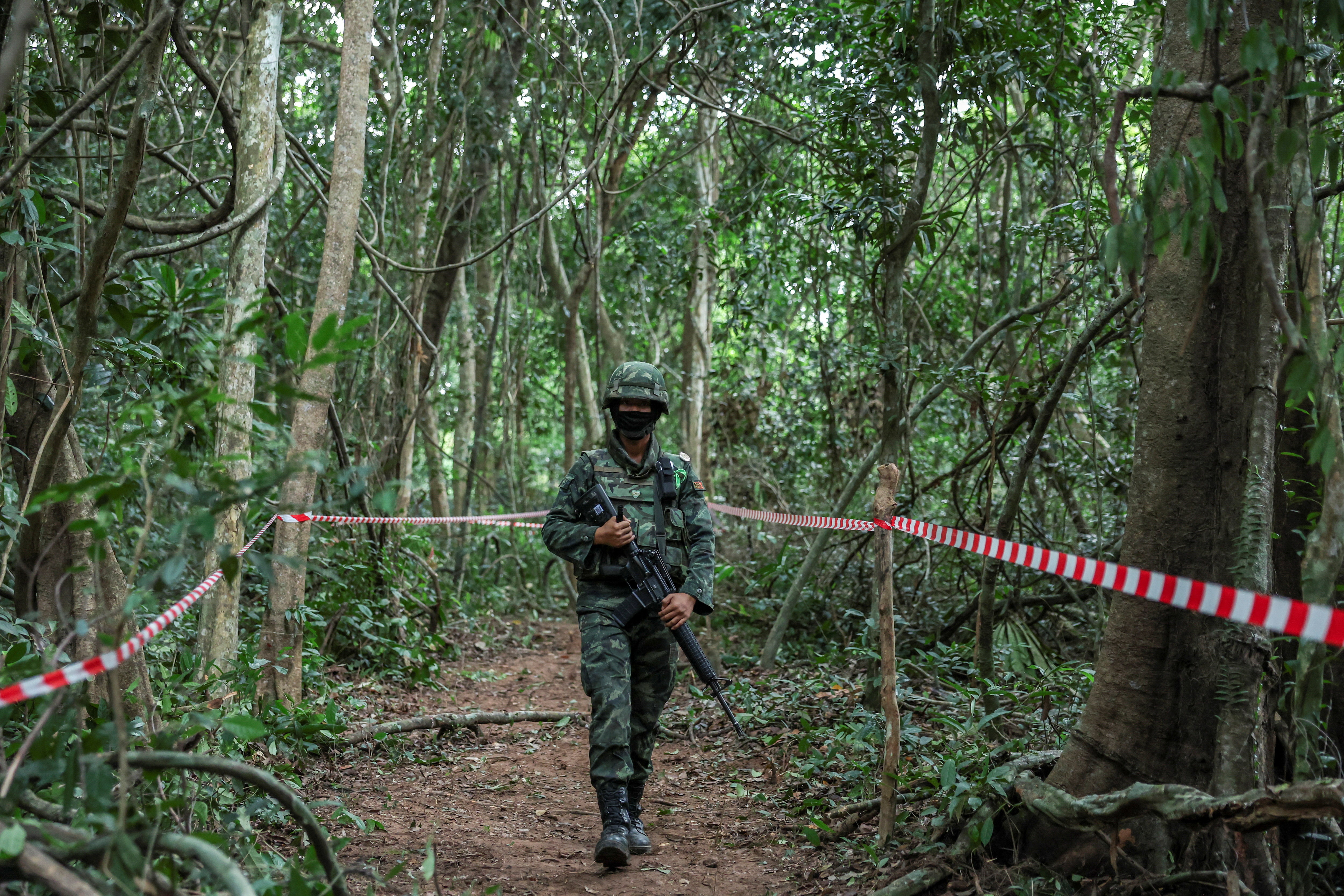 Thai military personnel stand guard near Thai-Cambodian border at Chong Chub Ta Mok area in Surin Province