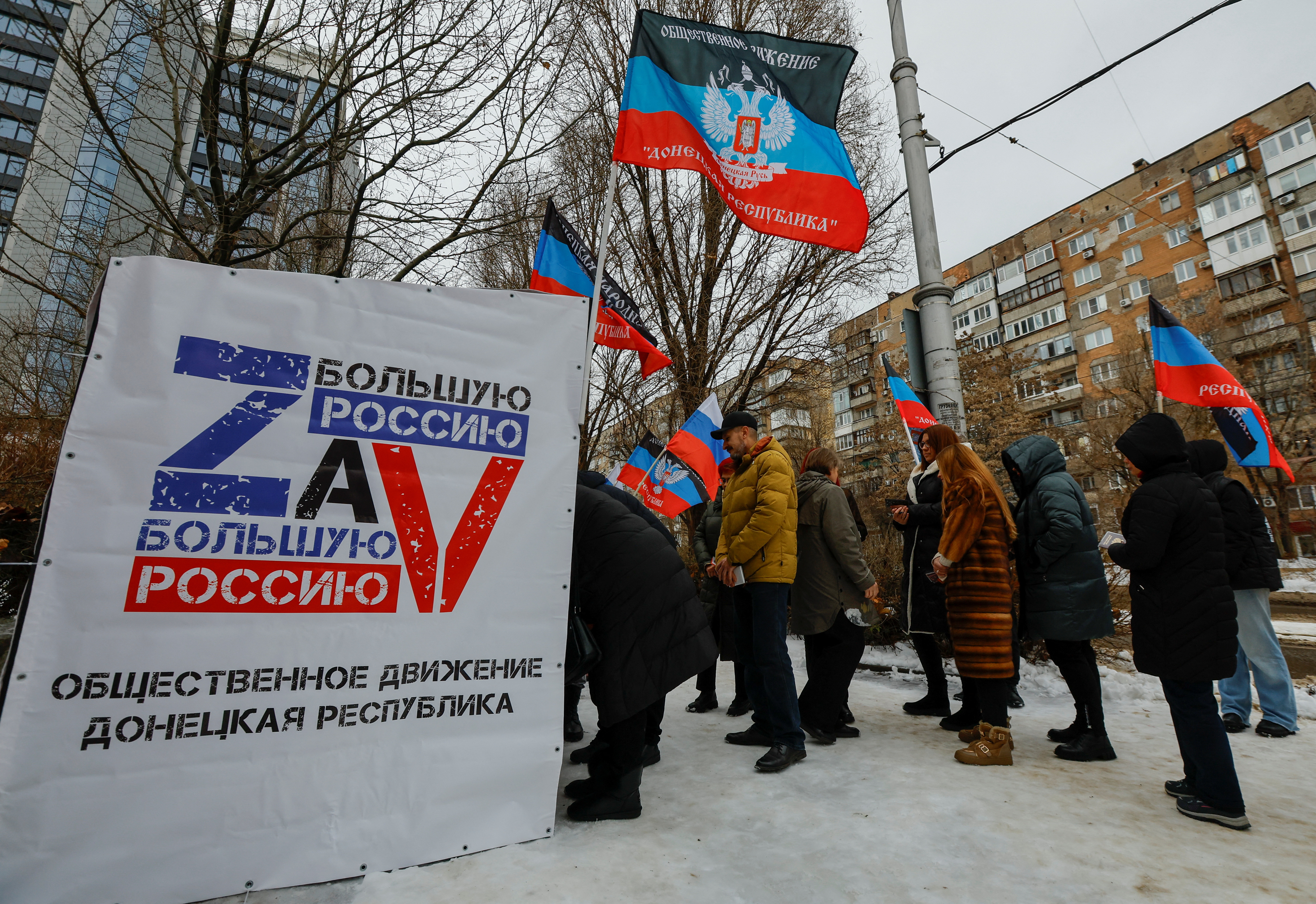 Activists collect signatures in support of Russian President Vladimir Putin as a candidate in the upcoming presidential election, in Donetsk
