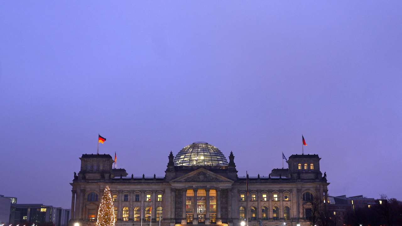 The illuminated Reichstag building in Berlin