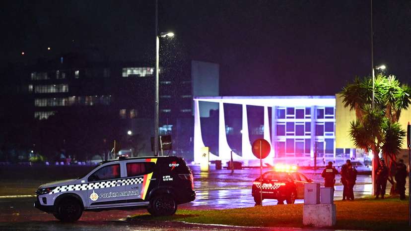 Police vehicles are seen in front of the Brazilian Supreme Court after explosions in the Three Powers Square in Brasilia