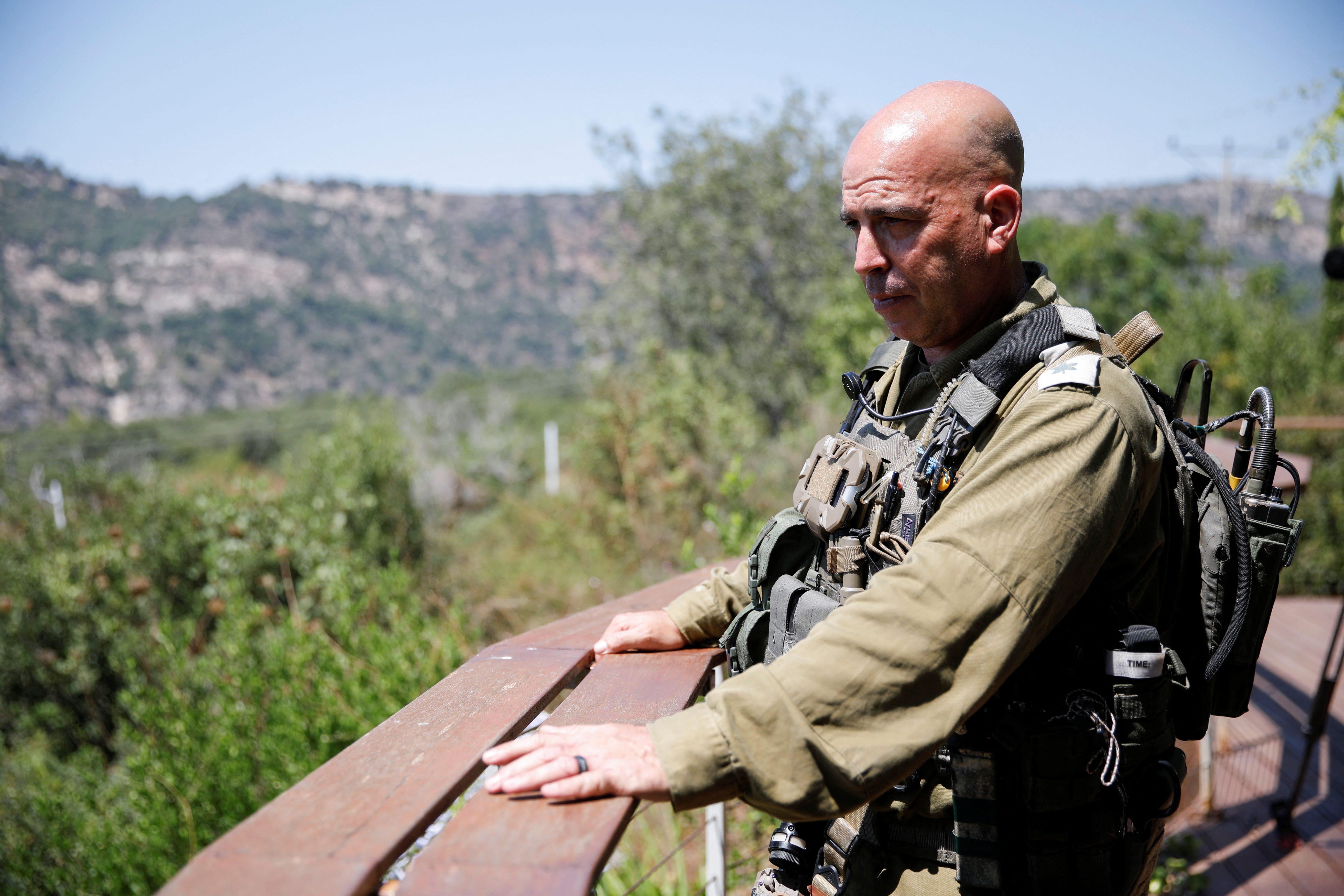 Israeli soldier Lieutenant Colonel Dotan looks out from a deck at Kibbutz Eilon, amid cross-border hostilities between Hezbollah and Israeli forces, in northern Israel