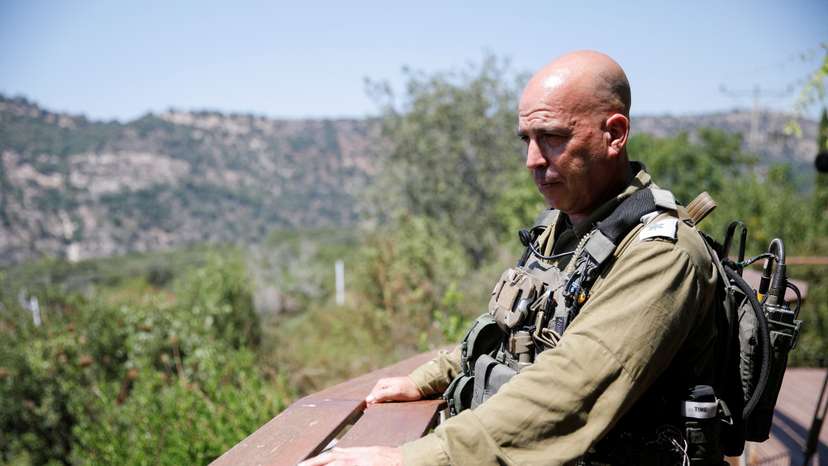 Israeli soldier Lieutenant Colonel Dotan looks out from a deck at Kibbutz Eilon, amid cross-border hostilities between Hezbollah and Israeli forces, in northern Israel