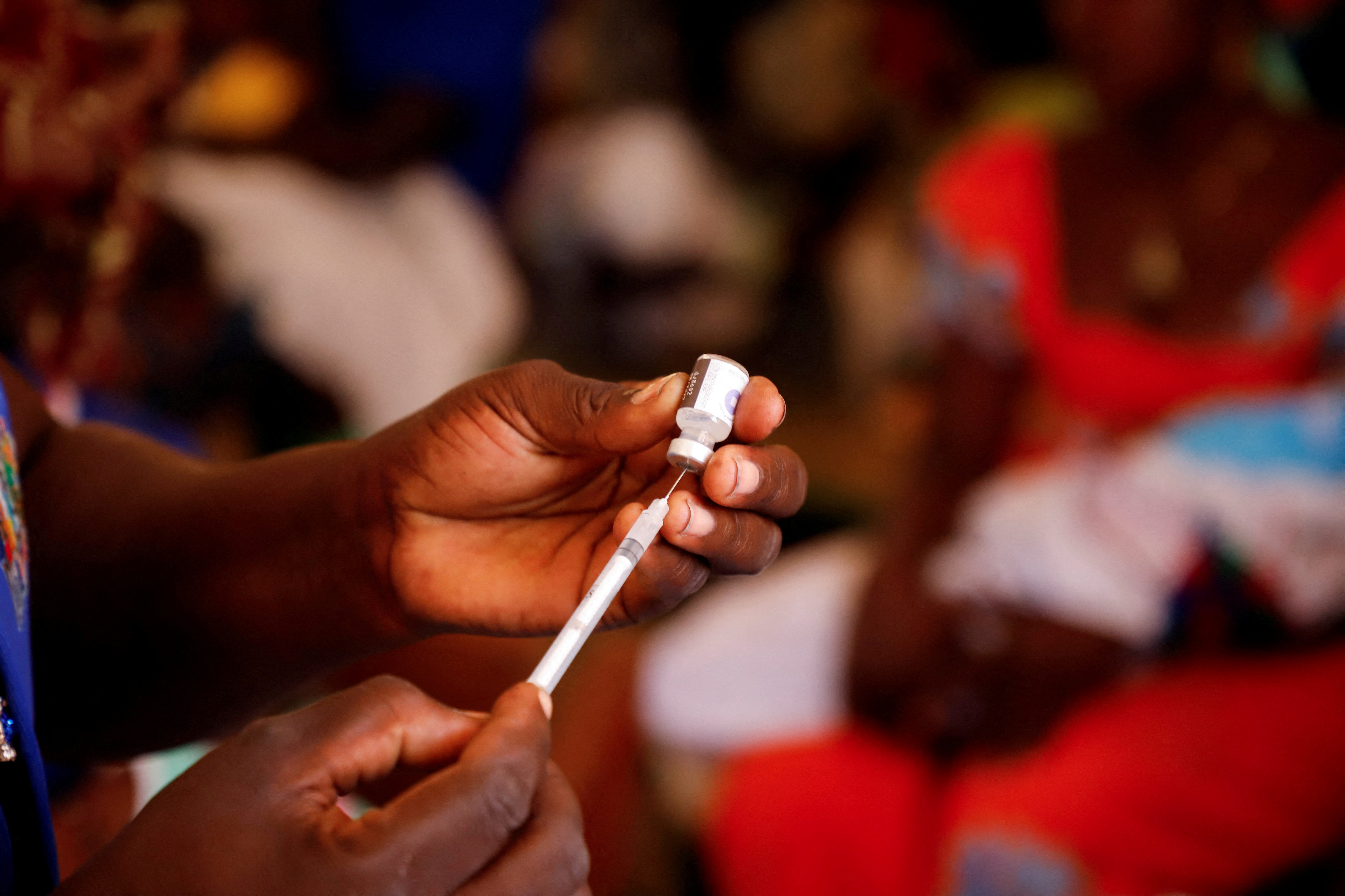 FILE PHOTO: FILE PHOTO: A nurse prepares to administer a malaria vaccine to an infant at the health center in Datcheka