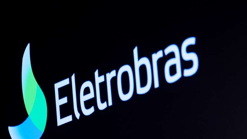 The logo for Eletrobras, a Brazilian electric utilities company, is displayed on a screen on the floor at the NYSE in New York