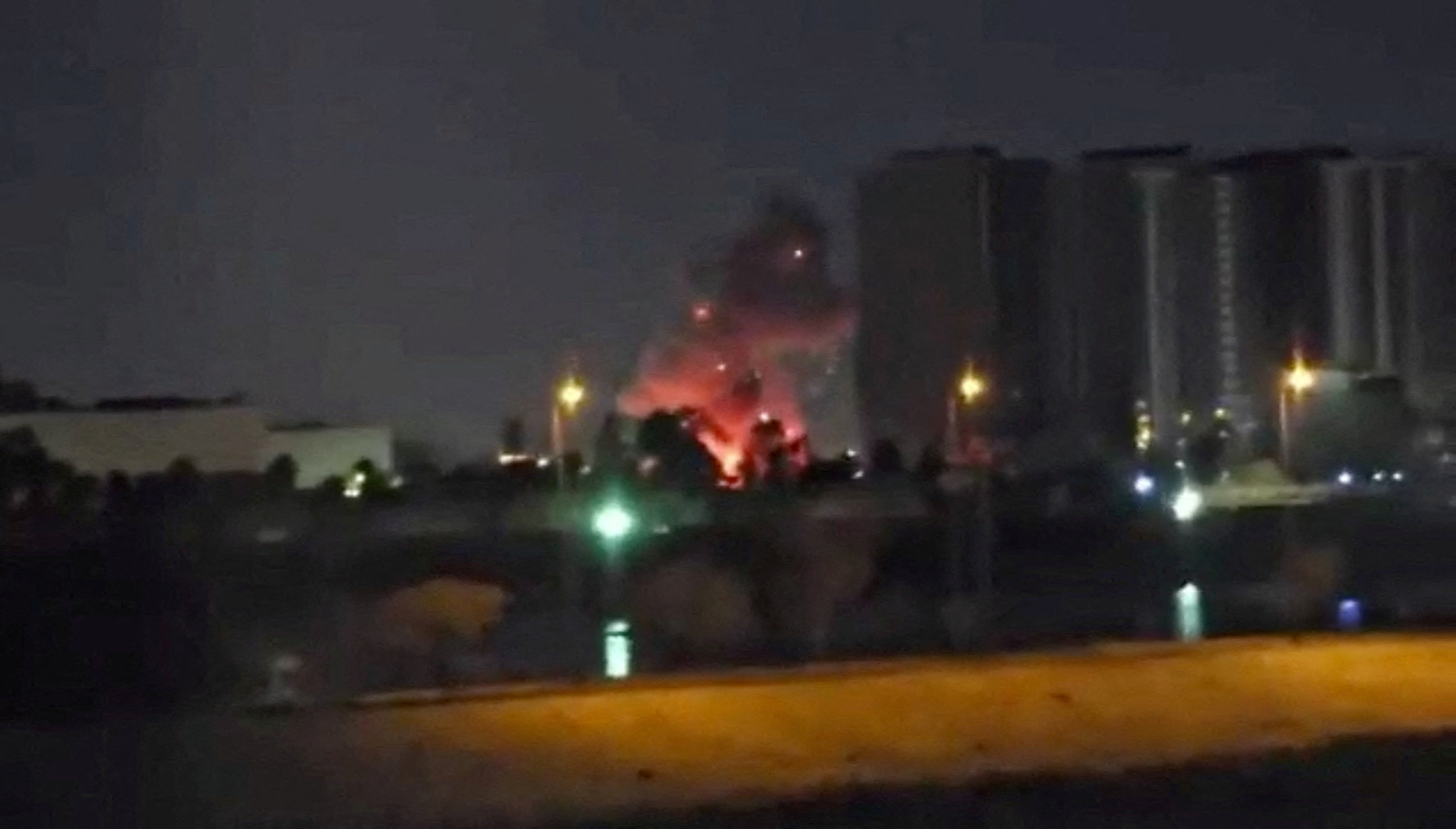 Smoke and fire rise during reported drone and rocket strikes at U.S. embassy in Baghdad