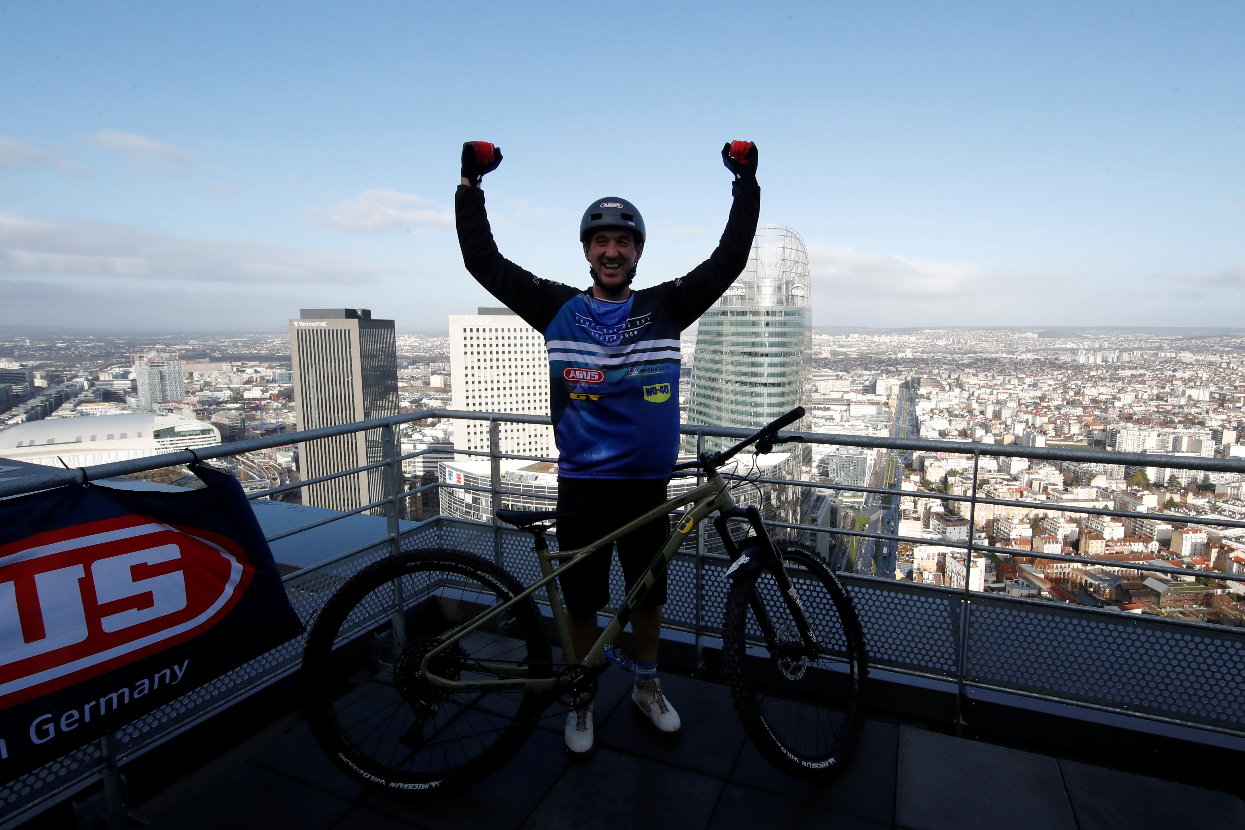 French athlete climbs 33-story tower on his mountain bike in La Defense near Paris